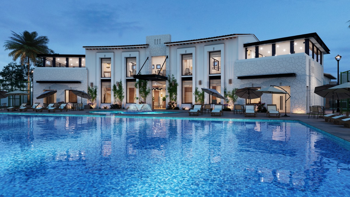 Picture of the exterior of a high-end hotel with an enormous outdoor pool.