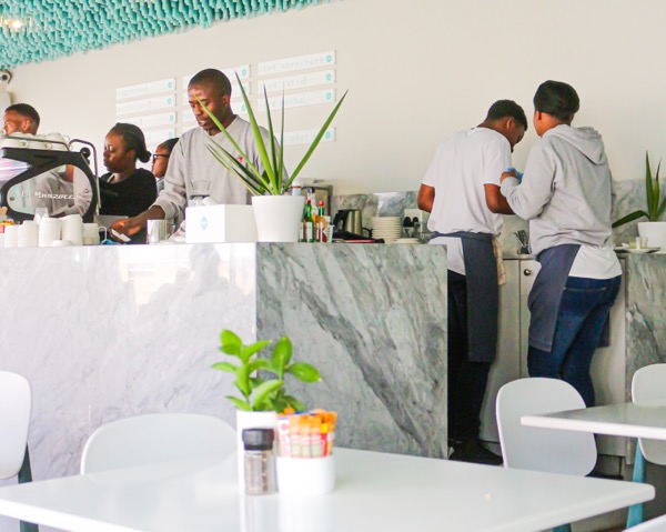 Restaurant staff working behind the counter.