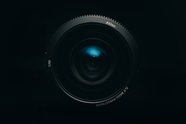 Image of the front of a black point and shoot camera with an 82mm lens. Like a camera, optical character recognition utilizes the computer's eye to translate the image of a paper document. Software that automates data extraction either uses OCR or transcription, digitizing and converting text.