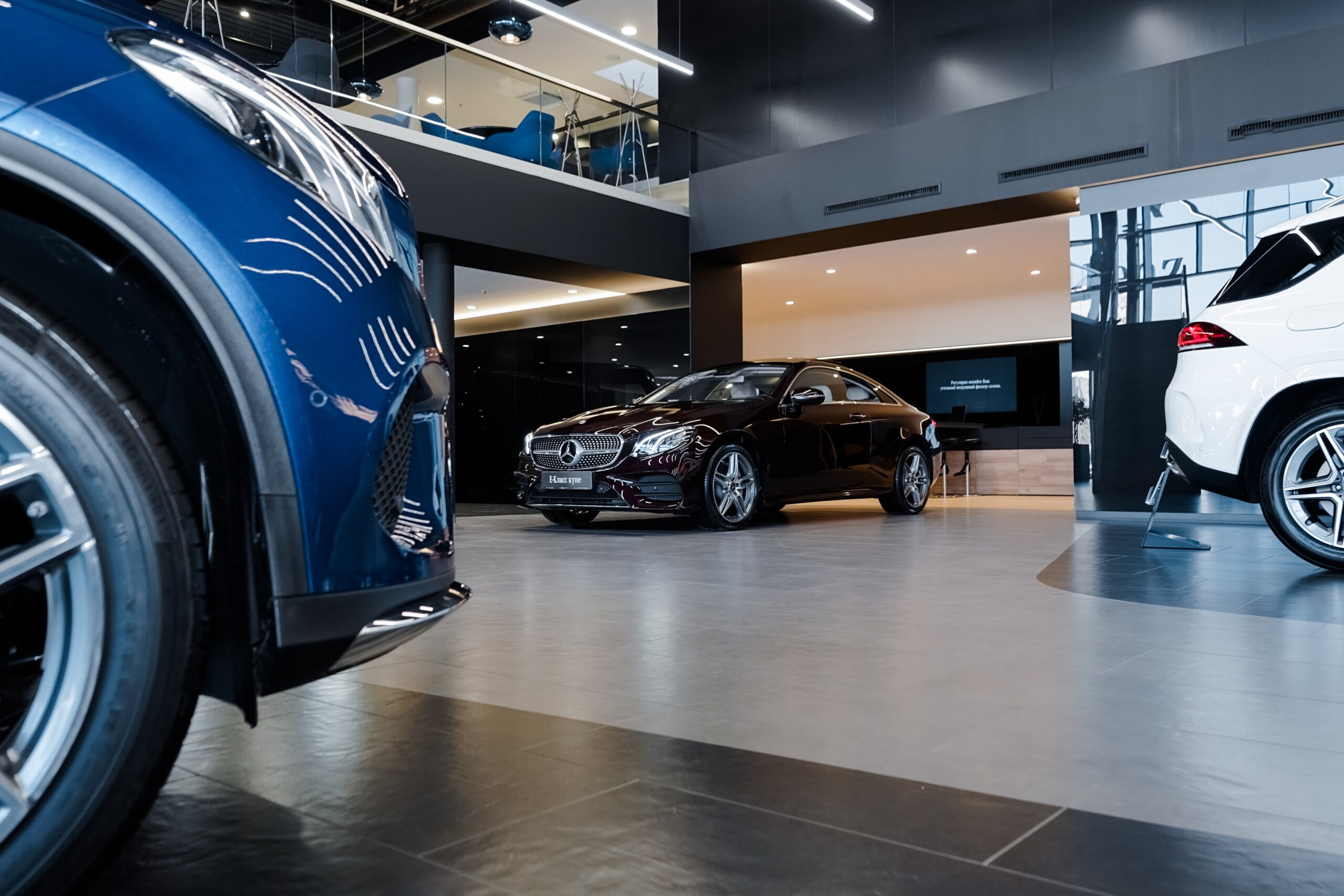 car dealership main floor with cars on display