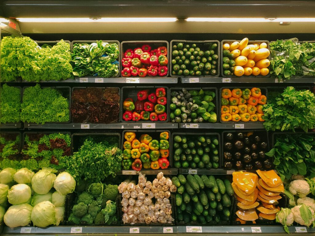A display of fresh vegetable produce at a grocery store.