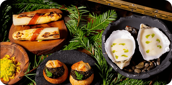A table of gourmet food and drinks